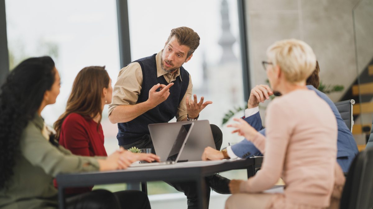 Team meeting with laptops in an office